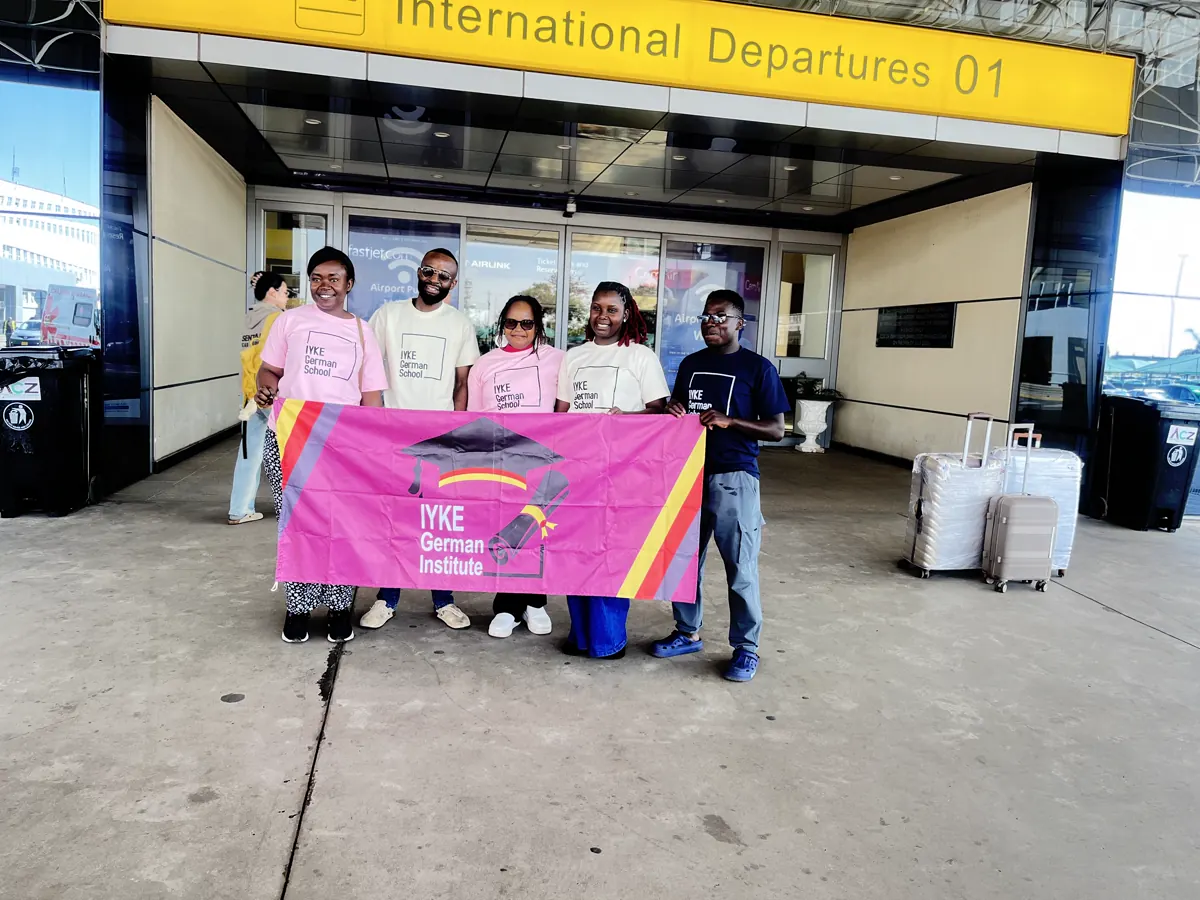 Iyke German Institute team supporting a student at an international departure