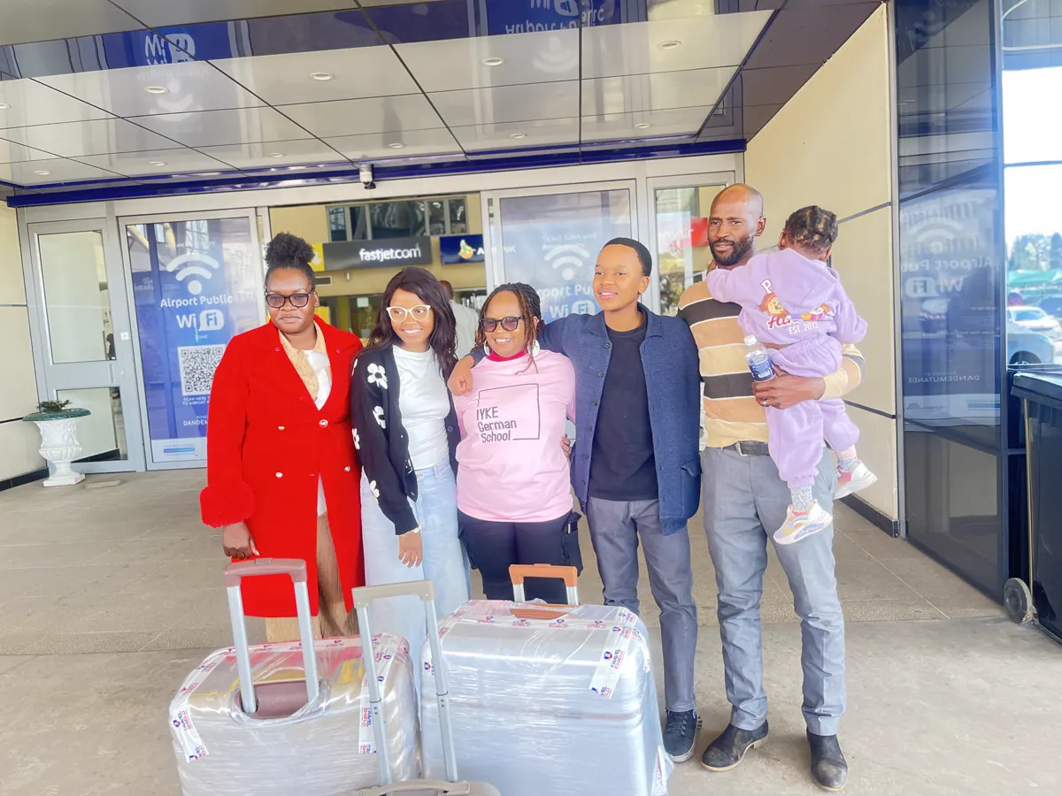 Iyke German Institute supporters with a student preparing for an international journey